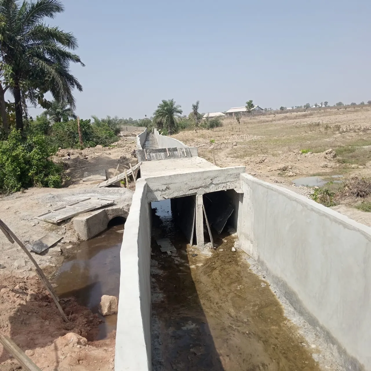 Concrete box culvert and channel walls with water flowing through